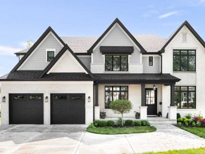 A Grey And White Modern Farmhouse With Black Accents