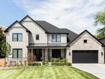 A Tan Modern Farmhouse With Covered Front Porch